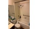 Bright bathroom with shower over tub, grab bars and tiled surround at , Las Vegas, NV 89102