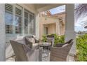 Cozy outdoor patio with wicker seating area perfect for relaxing and enjoying the fresh air at 10004 W Cherokee Ave, Las Vegas, NV 89147