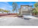 Inviting two-story home featuring a two-car garage and low-maintenance landscaping at 10529 Mount Blackburn Ave, Las Vegas, NV 89166