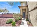 Inviting front entrance featuring a stylish front door and desert landscaping at 10529 Mount Blackburn Ave, Las Vegas, NV 89166