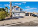 Charming two-story home with a spacious driveway, a two-car garage, and desert landscaping at 108 Appian Way, Henderson, NV 89002