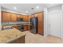 Spacious kitchen with stainless steel appliances, granite counters, and ample cabinet space at 11408 Newton Commons Dr # 104, Las Vegas, NV 89135