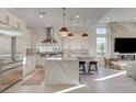 Gourmet kitchen featuring a large center island, stainless appliances, and modern pendant lighting at 12199 Canyon Sunset St, Las Vegas, NV 89138