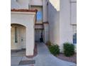 Inviting condo entrance with a well-kept walkway and attractive architectural details at 1621 Sandecker Ct # 104, Las Vegas, NV 89146