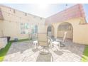 View of a large brick-paved patio with seating, decorative lights and an inviting ambiance at 1709 Chapman Dr, Las Vegas, NV 89104
