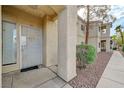 Exterior entrance featuring security gate, address number and welcoming door decor at 1881 W Alexander Rd # 1135, North Las Vegas, NV 89032