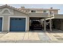 Townhouse with covered parking and garage door, showing unit number, offering convenience and shelter at 2282 Camel Mesa Dr, Laughlin, NV 89029