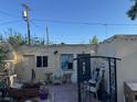 A backyard featuring vintage furniture and string lights, creating a nostalgic outdoor space at 2520 Sunrise St, Las Vegas, NV 89101