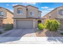 Two-story home with a two-car garage, neutral stucco, and low-maintenance landscaping at 2878 Chalk Mountain Ct, Las Vegas, NV 89142
