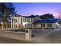 Stunning two-story home with a large driveway and well-manicured front yard at 3010 La Mesa Dr, Henderson, NV 89014
