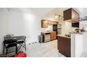 Open concept kitchen with stainless appliances, tile floor, and a breakfast bar at 3135 S Mojave Rd # 241, Las Vegas, NV 89121