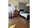 Comfortable bedroom design with hardwood floors and modern furnishings at 353 E Bonneville Ave # 631, Las Vegas, NV 89101