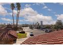 Neighborhood view featuring the Las Vegas skyline with a tiled roof in the foreground at 5010 Mick Pl, Las Vegas, NV 89103