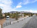 An aerial view of the property highlighting perimeter fencing and mountain views at 5570 N Nopah Vista Ave, Pahrump, NV 89060