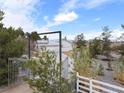 View of the property entrance showing gated driveway and street address sign at 5570 N Nopah Vista Ave, Pahrump, NV 89060