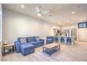 Open-concept living space with kitchen breakfast bar and comfortable furniture at 6437 Wide Sky St, Las Vegas, NV 89166