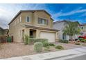 Inviting two-story home featuring a well-maintained lawn, paved driveway, and charming curb appeal at 7109 Red Gulch St, North Las Vegas, NV 89084