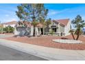 Attractive single-story house with a tile roof, low maintenance landscaping, and two-car garage at 8500 Gull Dr, Las Vegas, NV 89134