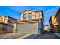 Inviting two-story home featuring an attached two-car garage, stucco siding, and a beautifully tiled roof at 8532 Caddy Corner St, Las Vegas, NV 89139