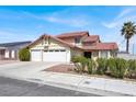 Charming two-story home with a well-maintained lawn and a spacious two-car garage at 8600 Soneto Ln, Las Vegas, NV 89117
