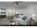 Open concept living room and kitchen showcasing seamless flow and modern design with barstool seating at 890 Apatite Pl # Lot 68, Henderson, NV 89011