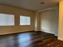 Bright living room features hard wood floors, natural light, and a neutral color palette at 9078 Camp Light Ave # 102, Las Vegas, NV 89149