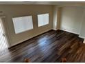 Bright living room features hard wood floors, natural light, and a neutral color palette at 9078 Camp Light Ave # 102, Las Vegas, NV 89149
