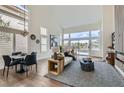 Open-concept living space featuring high ceilings, neutral tones, and stylish furnishings at 916 Pro Players Dr, Las Vegas, NV 89134