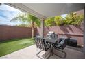 Outdoor patio featuring a dining table and grill, perfect for alfresco dining and entertaining in a private setting at 9277 Valley Ranch Ave, Las Vegas, NV 89178