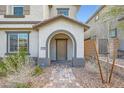 Charming home entrance with brick pathway and covered porch at 10650 Sariah Skye Ave, Las Vegas, NV 89166
