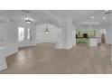 Spacious living room with hardwood floors, high ceilings, and lots of natural light, creating a bright and welcoming atmosphere at 4722 Blue Mesa Way, Las Vegas, NV 89129