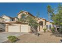 Inviting two-story home featuring well-maintained landscaping, a three-car garage, and a welcoming entrance at 8447 Amherst Valley St, Las Vegas, NV 89123