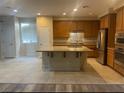 Spacious kitchen features granite countertops, stainless steel appliances, and a central island at 8584 Garnet Lake Ave, Las Vegas, NV 89113