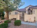 Charming single-story home with well-maintained landscaping and a cozy front patio at 10657 San Vercelli Ct, Las Vegas, NV 89141