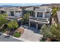 Expansive aerial view of a modern home featuring well-manicured landscaping at 29 Owl Ridge Ct, Las Vegas, NV 89135
