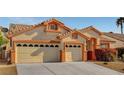 Lovely single-story home featuring a convenient three-car garage and manicured front yard at 3071 Misty Moon Ave, Henderson, NV 89052