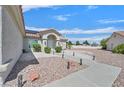 Inviting single-story home boasts desert landscaping, adding to the curb appeal at 3109 Hawksdale Dr, Las Vegas, NV 89134