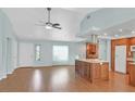Bright, open-concept space with hardwood floors, featuring a large kitchen island at 3109 Hawksdale Dr, Las Vegas, NV 89134