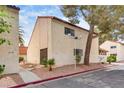 Exterior view of a multi-Gathering home with landscaped yard and architectural details at 3350 Duece St, Las Vegas, NV 89121