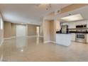 Open-concept living space flows into the kitchen with modern appliances and fixtures at 3350 Duece St, Las Vegas, NV 89121