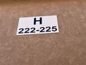 Apartment location sign for units H222 through H225 on textured beige exterior at 4300 N Lamont St # 225, Las Vegas, NV 89115