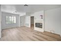 Spacious living room with a fireplace and light wood floors at 4855 S Torrey Pines Dr # 101, Las Vegas, NV 89103
