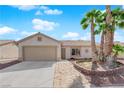 Charming single-story home featuring a well-maintained yard and a two-car garage at 5222 Joshua Jose St, North Las Vegas, NV 89031