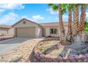 Well maintained single-story home with desert landscaping and a convenient two-car garage at 5222 Joshua Jose St, North Las Vegas, NV 89031