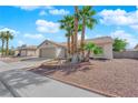 Attractive single-story home with low maintenance desert landscaping and a two-car garage at 5222 Joshua Jose St, North Las Vegas, NV 89031