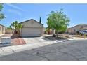 Charming single-story home featuring desert landscaping, attached garage, and a well-maintained front yard at 5904 Oakton St, Las Vegas, NV 89130
