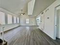 Open-concept living room with new flooring and bright, white walls that complement the space at 5928 Willard St, Las Vegas, NV 89122