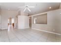 Open living room showcasing tile floors, neutral paint and airy layout at 6149 Elderberry Wine Ave, Las Vegas, NV 89142