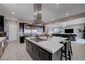 Spacious kitchen featuring stainless steel appliances, large center island, and dark wood cabinets at 746 Horizon Canyon Dr, Henderson, NV 89052