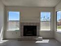 The living room features a decorative tile fireplace and a view of the neighborhood at 8072 Hackberry Dr, Las Vegas, NV 89123